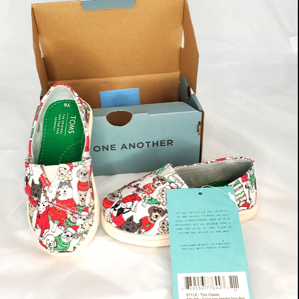 Toms tiny shoes size 6, slip on, dogs in s…